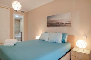 Posteľ alebo postele v izbe v ubytovaní Beach and golf apartament