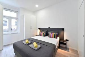 Postel nebo postele na pokoji v ubytování Agape Apartments