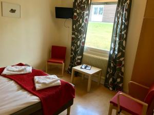 Postel nebo postele na pokoji v ubytování STF Malmfältens Folkhögskola