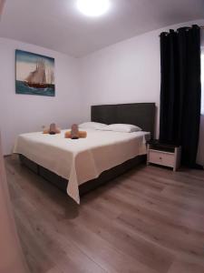 Postel nebo postele na pokoji v ubytování Apartman Noah