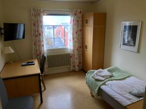 Postel nebo postele na pokoji v ubytování STF Malmfältens Folkhögskola