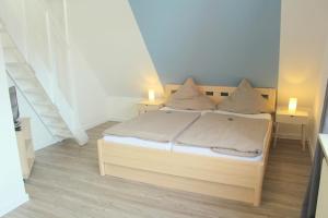 Postel nebo postele na pokoji v ubytování Appartment Vermietung Lütje