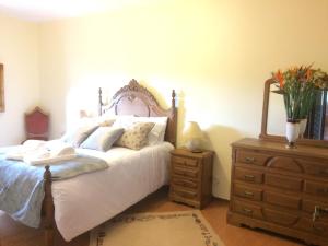 Postel nebo postele na pokoji v ubytování Amarante Little House