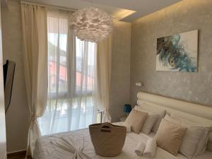 Postel nebo postele na pokoji v ubytování Butterfly Apartman