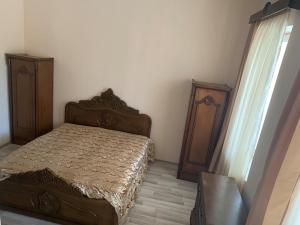 Postel nebo postele na pokoji v ubytování Jintcharadze Inn