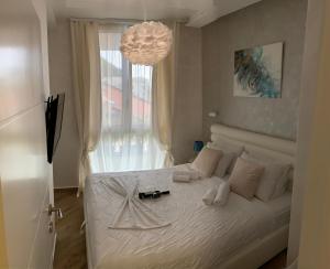 Postel nebo postele na pokoji v ubytování Butterfly Apartman