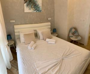 Postel nebo postele na pokoji v ubytování Butterfly Apartman