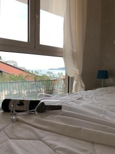 Postel nebo postele na pokoji v ubytování Butterfly Apartman