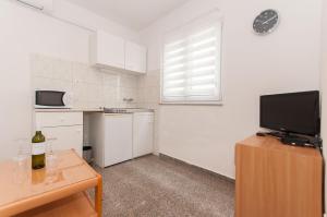 Kuchyň nebo kuchyňský kout v ubytování Apartmani Vesna