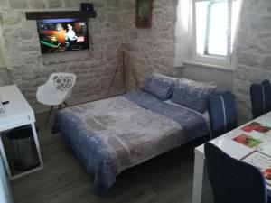 Tempat tidur dalam kamar di Apartment BUGA