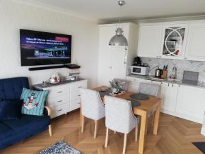 Kuchyň nebo kuchyňský kout v ubytování Apartament na Morskim Wzgórzu