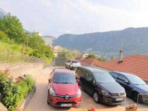 a group of cars parked in a parking lot at Apartments Lazarević in Kotor
