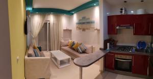 Kuchyň nebo kuchyňský kout v ubytování Kariat Cabo - Appartement Charmant, Climatisé avec Vue Piscine