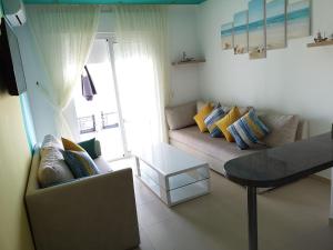 Posezení v ubytování Kariat Cabo - Appartement Charmant, Climatisé avec Vue Piscine