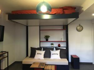 a bedroom with a bunk bed with a bed underneath it at Studio 33 in Nice