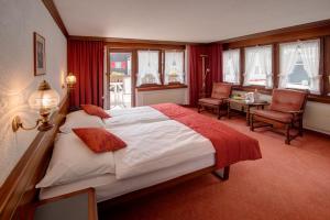 Postel nebo postele na pokoji v ubytování Hotel Astoria