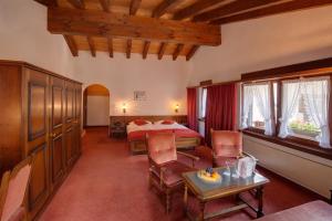 Postel nebo postele na pokoji v ubytování Hotel Astoria