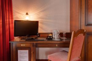 TV a/nebo společenská místnost v ubytování Hotel Astoria
