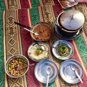a group of bowls of food on a table at Bedouins life camp in Aqaba +65 photos