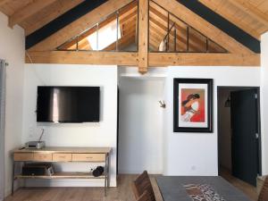 a living room with a flat screen tv on a wall at Euskal etxea in Bayonne