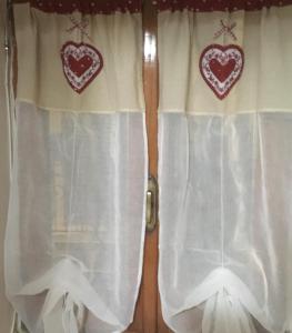 two hearts on the curtains of a window at Pretoria House in Potenza