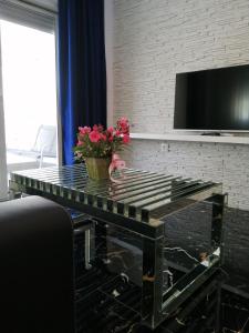 A television and/or entertainment centre at TOTANI LUX