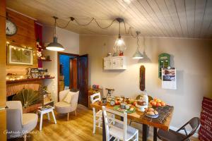 a kitchen and dining room with a table and chairs at Il Piccolo Tibet - Gran Sasso in LʼAquila