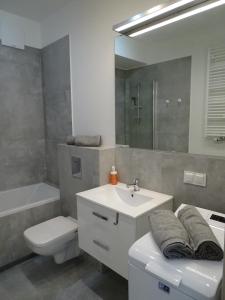 Kylpyhuone majoituspaikassa Apartament Słoneczny