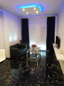 A television and/or entertainment centre at TOTANI LUX