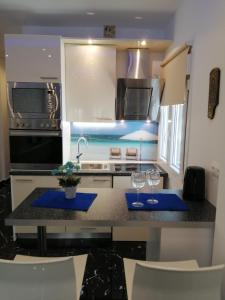 A kitchen or kitchenette at TOTANI LUX