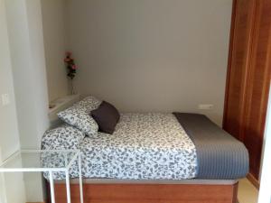 Posteľ alebo postele v izbe v ubytovaní VIVIENDA DE USO TURISTICO FREIRE