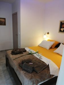 A bed or beds in a room at TOTANI LUX