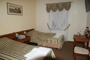 Tempat tidur dalam kamar di Hotel Chrobry