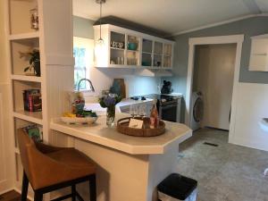 a kitchen with a counter with a basket on it at Beaufort SC New Renovation, Close to Parris Island, Historic Downtown, Beautiful Beaches, Sleeps 7 in Beaufort