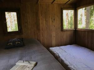 Кровать или кровати в номере Tahkuna tree-house