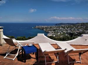 a table and chairs sitting on top of a roof at Villa Andrea in Ischia