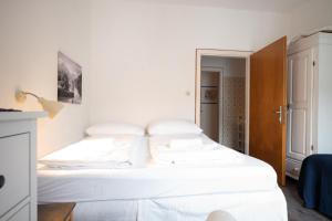 Postel nebo postele na pokoji v ubytování Living Eden by we rent, SUMMERCARD INCLUDED