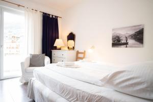 Postel nebo postele na pokoji v ubytování Living Eden by we rent, SUMMERCARD INCLUDED