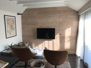 TV a/nebo společenská místnost v ubytování Poortbossen + 9 fotografií