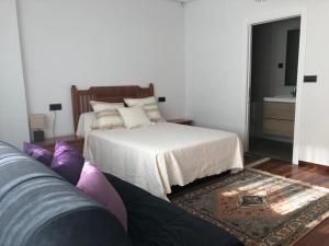 Posteľ alebo postele v izbe v ubytovaní Casa Castillo Finisterre
