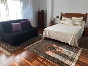 Posteľ alebo postele v izbe v ubytovaní Casa Castillo Finisterre