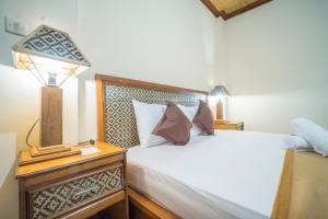 Postel nebo postele na pokoji v ubytování Jaga Roni House