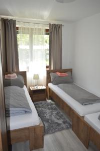Posteľ alebo postele v izbe v ubytovaní Apartmán Lopi