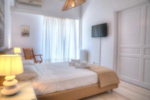 Posteľ alebo postele v izbe v ubytovaní L'appartement blanc dans le centre de Glyfada