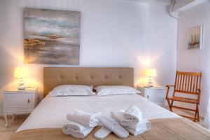 Posteľ alebo postele v izbe v ubytovaní L'appartement blanc dans le centre de Glyfada