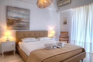 Posteľ alebo postele v izbe v ubytovaní L'appartement blanc dans le centre de Glyfada