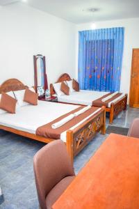 Postel nebo postele na pokoji v ubytování Lion Resort
