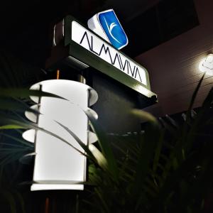 a street sign that reads amanwana at night at Almaviva Casa Hotel in Medellín