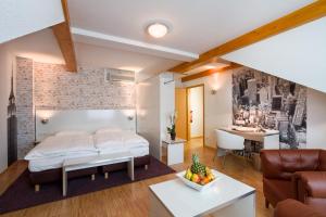 Postel nebo postele na pokoji v ubytování Hotel l'adresse garni