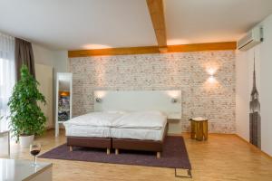 Postel nebo postele na pokoji v ubytování Hotel l'adresse garni